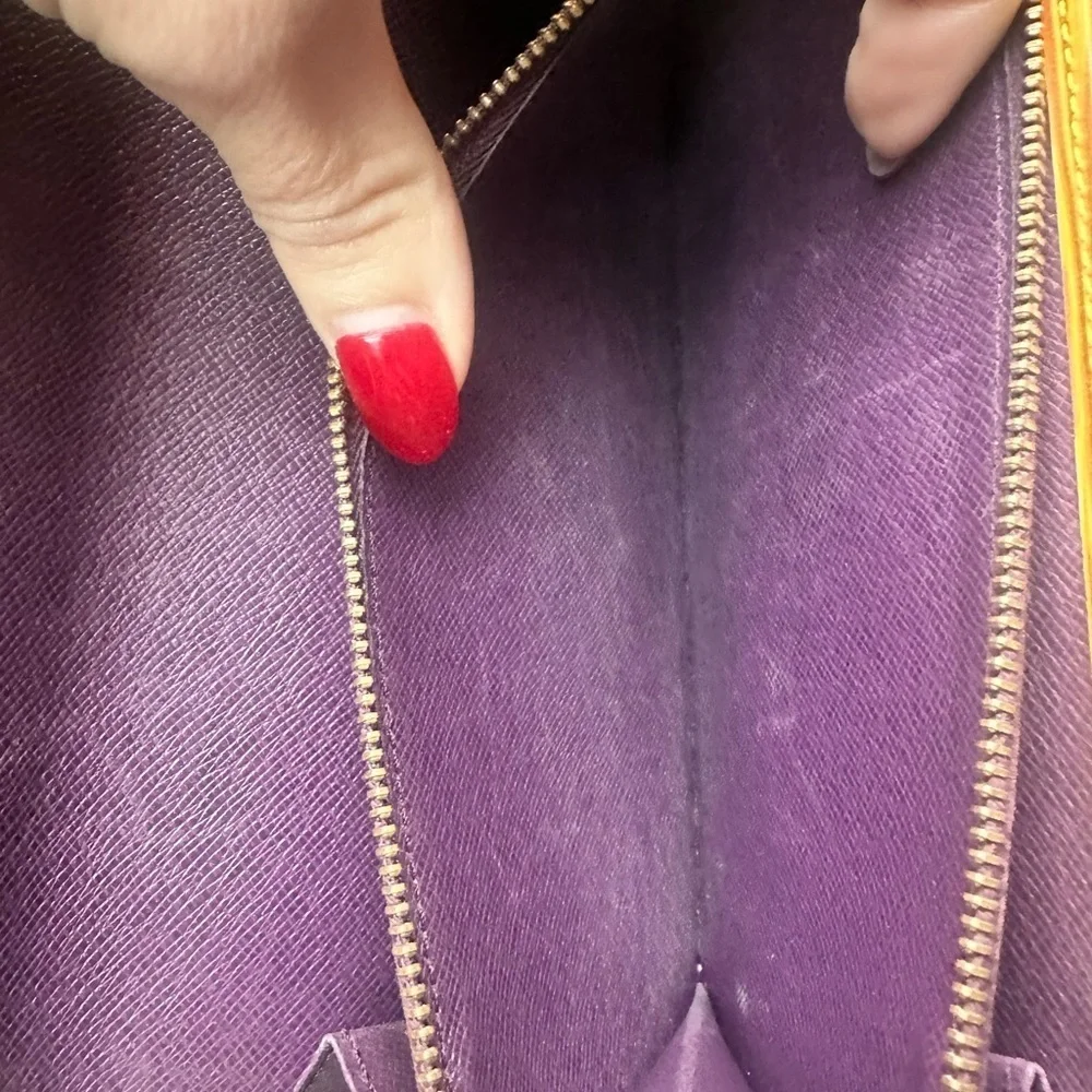 Louis Vuitton Yellow Epi Long Wallet with Purple Interior.